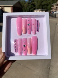 a pink nail set in a white box